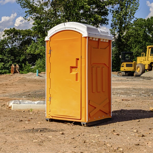 what is the cost difference between standard and deluxe portable restroom rentals in South Kortright